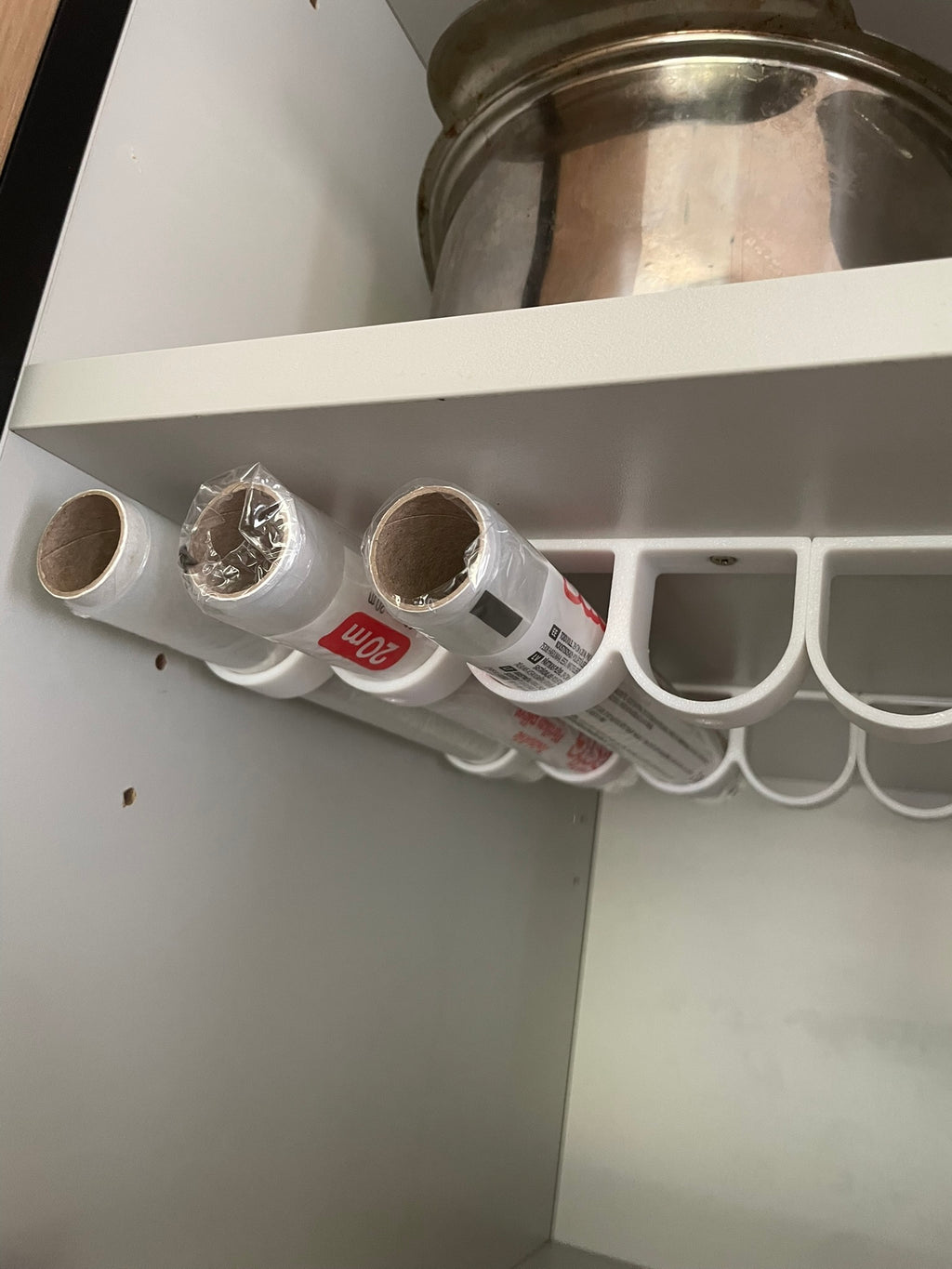 Rolls of kitchen foil and film organizer