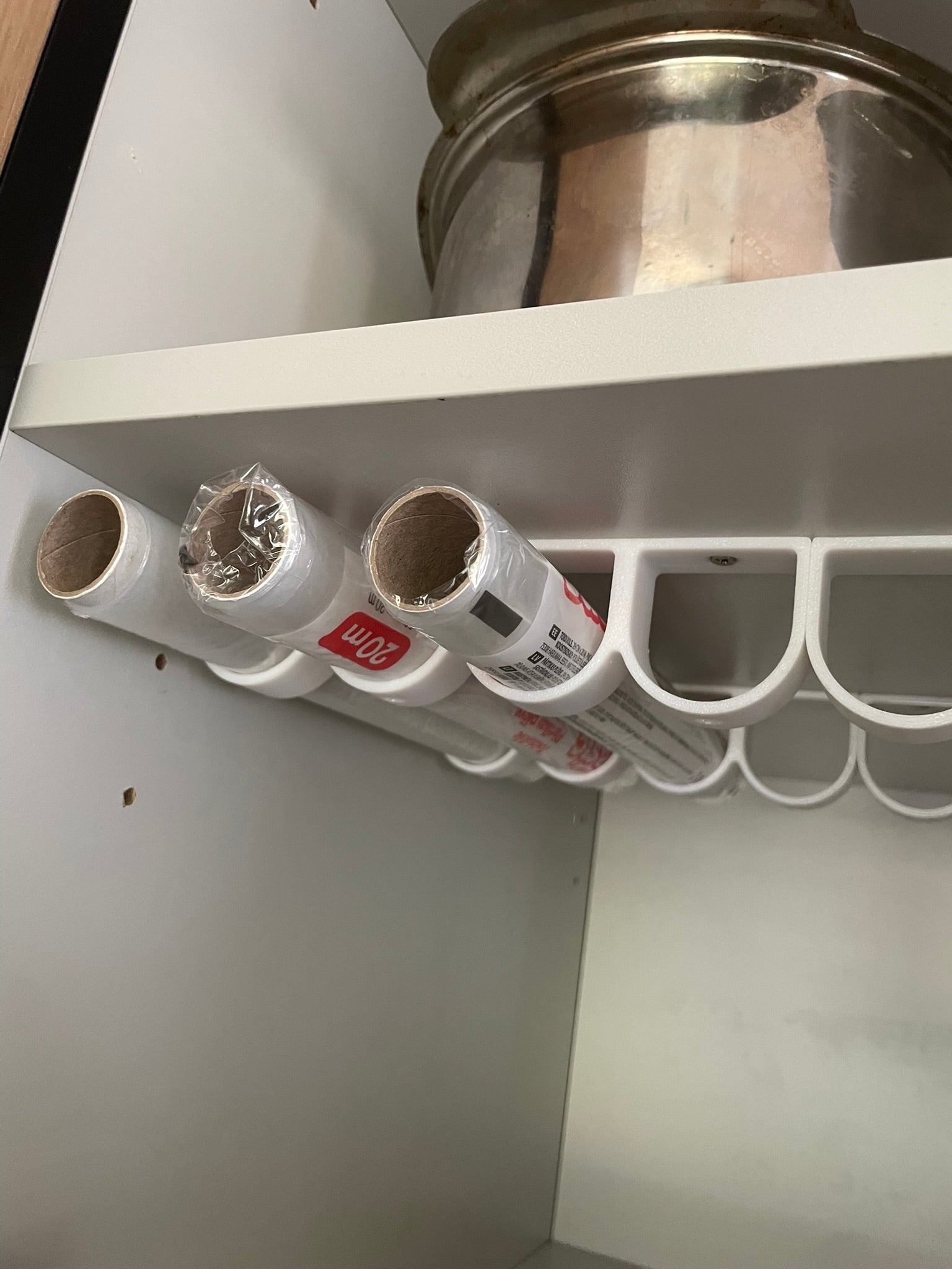 Rolls of kitchen foil and film organizer