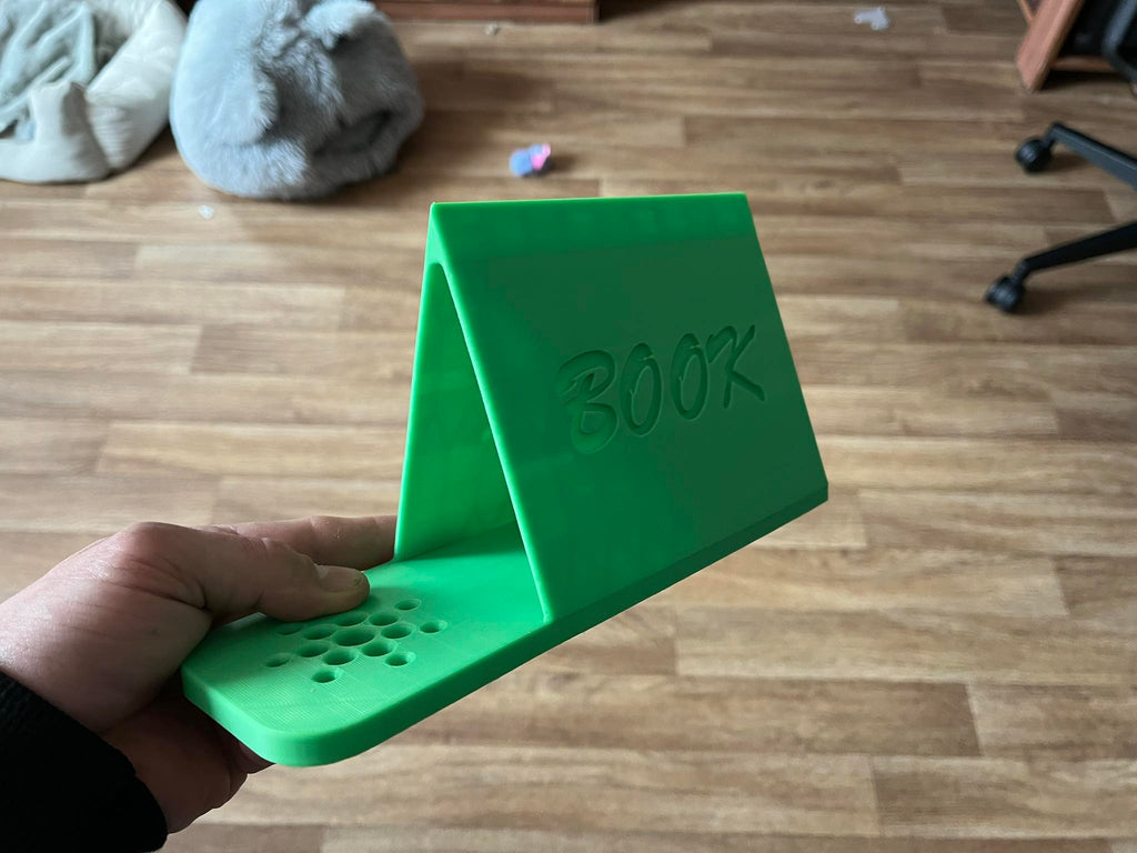 Holder for a read book and a mug of tea