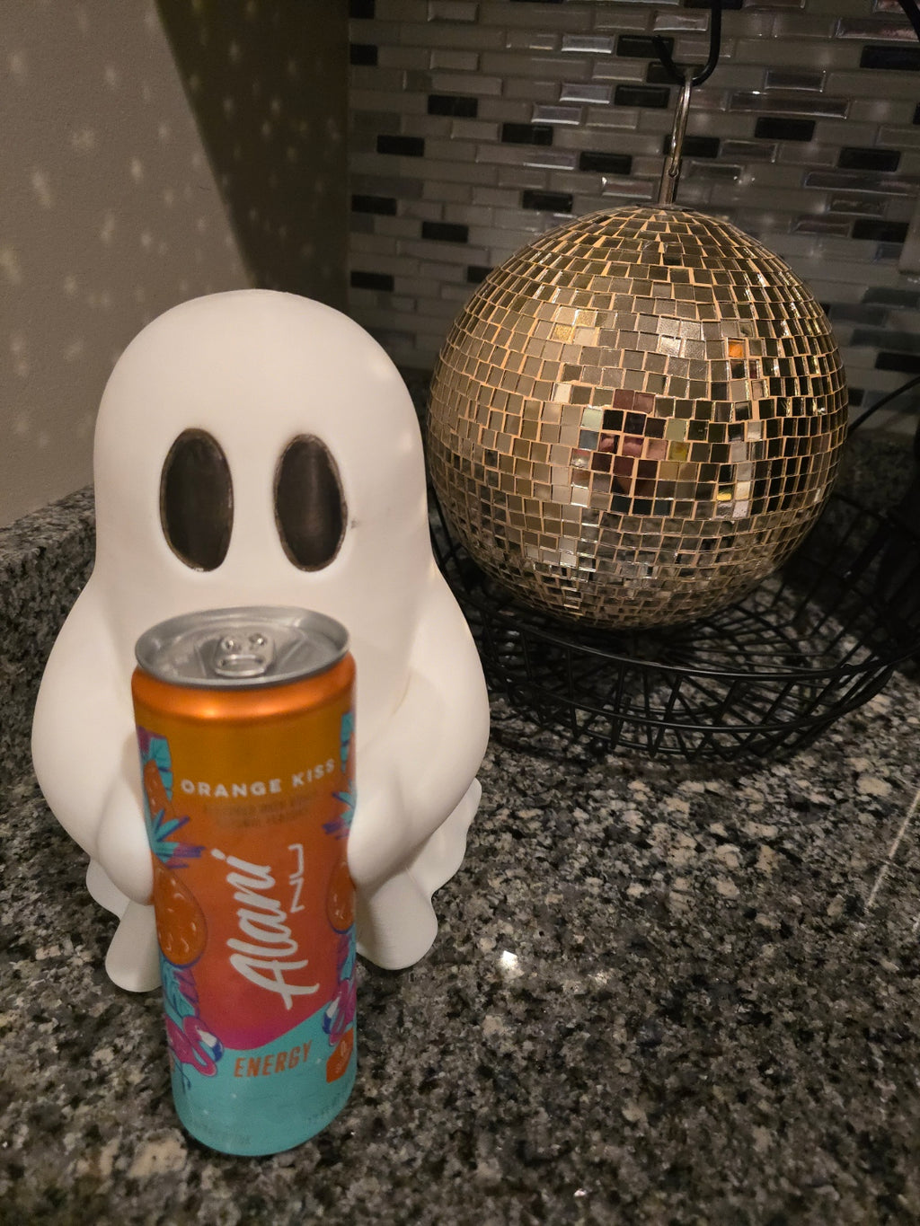 Ghosty holding soda can
