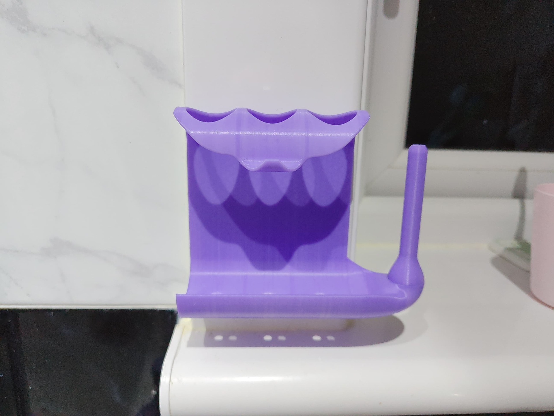 Toothpaste squeezer and toothbrush holder