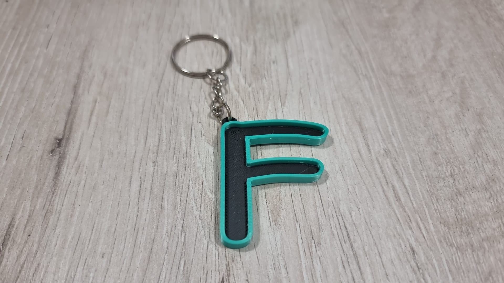 Letters for keychains with raised edge