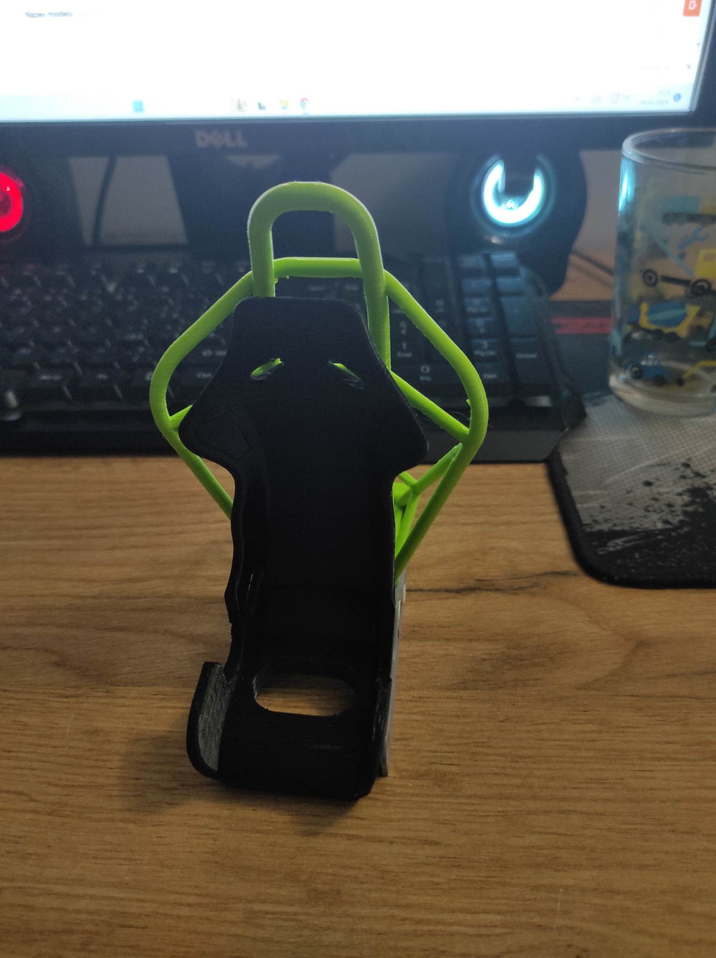 Racing seat phone stand with roll cage