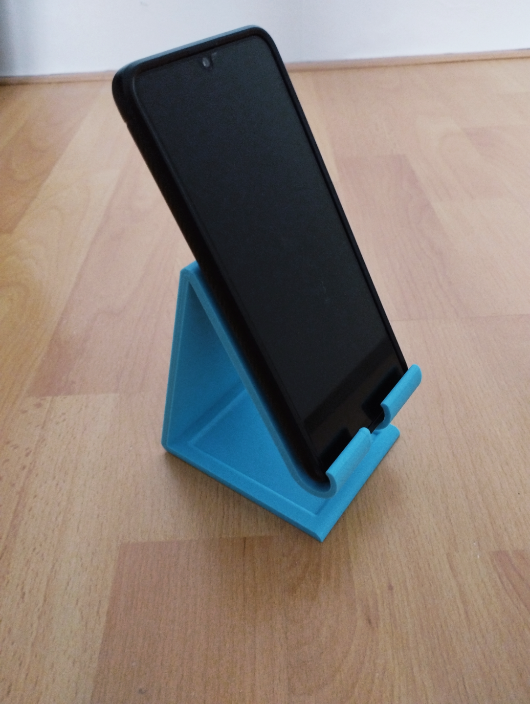 phone holder with charging cable hole