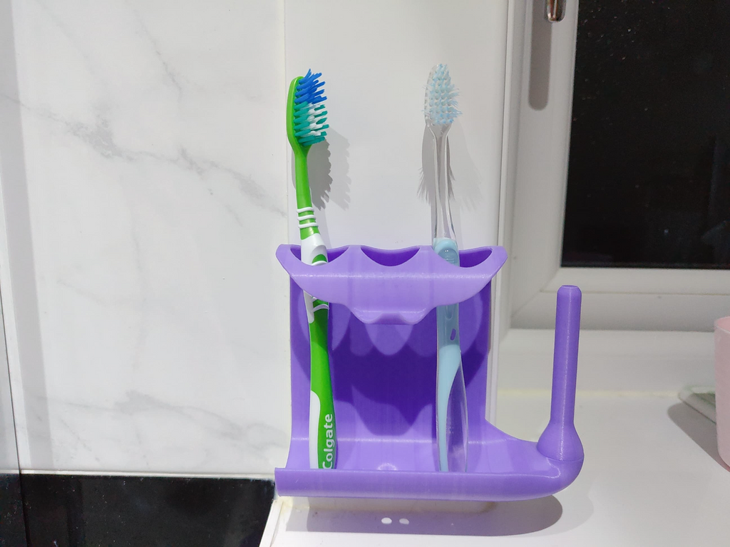 Toothpaste squeezer and toothbrush holder