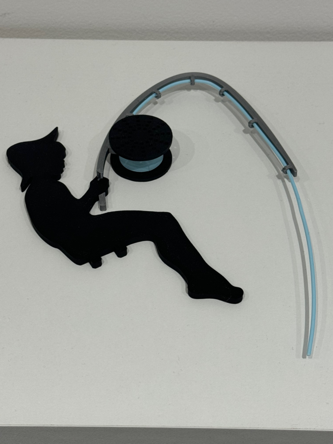FisherMan with fishing rod and reel filament spool