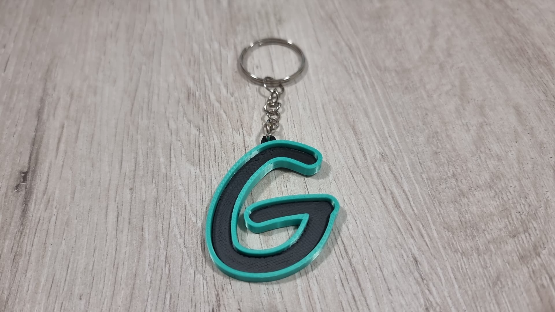 Letters for keychains with raised edge
