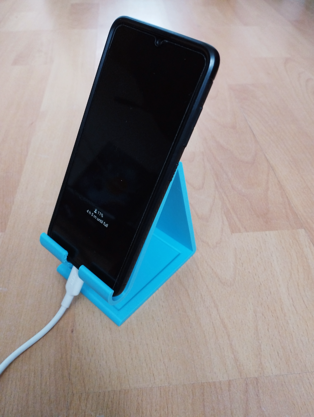 phone holder with charging cable hole