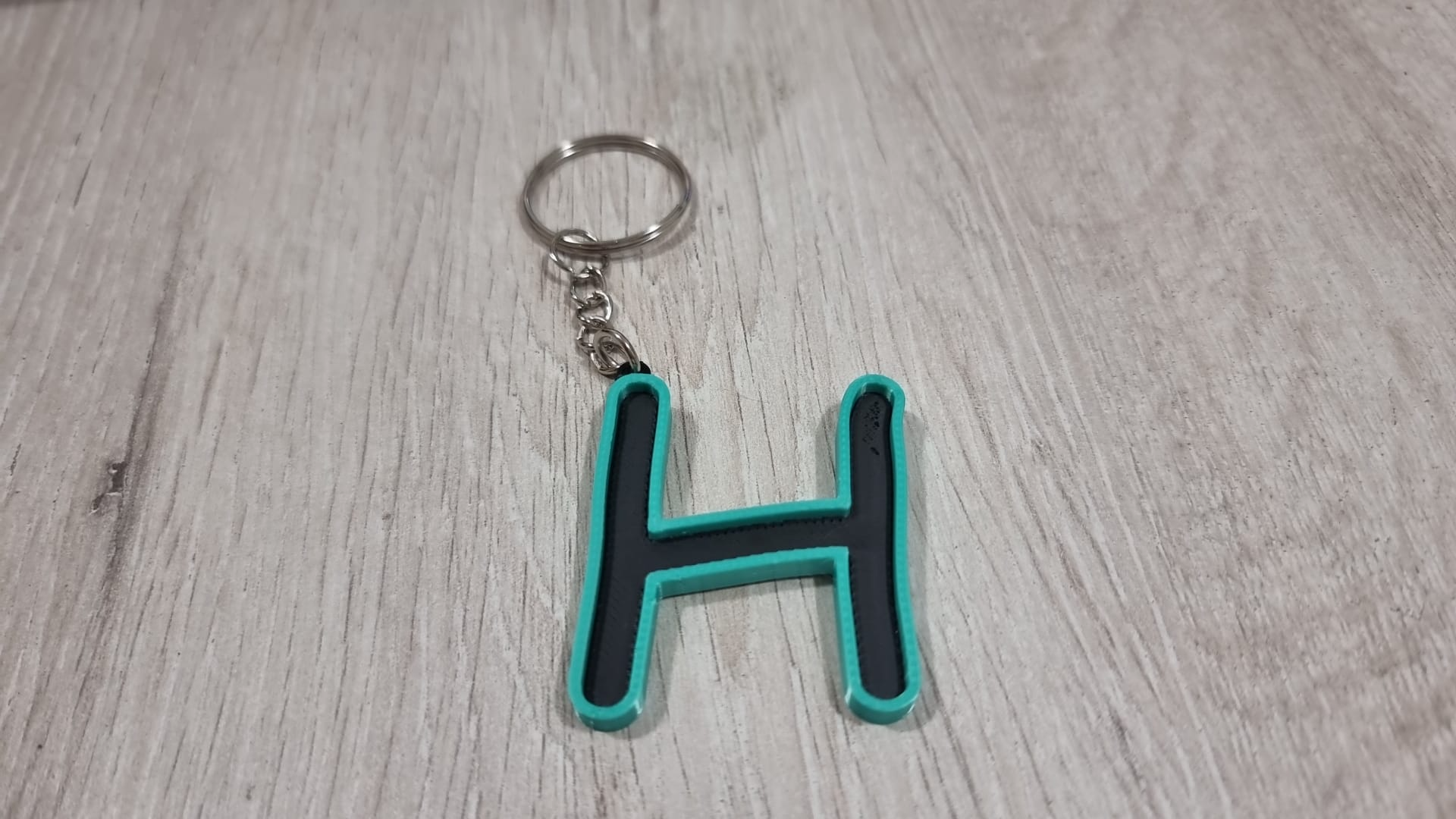 Letters for keychains with raised edge
