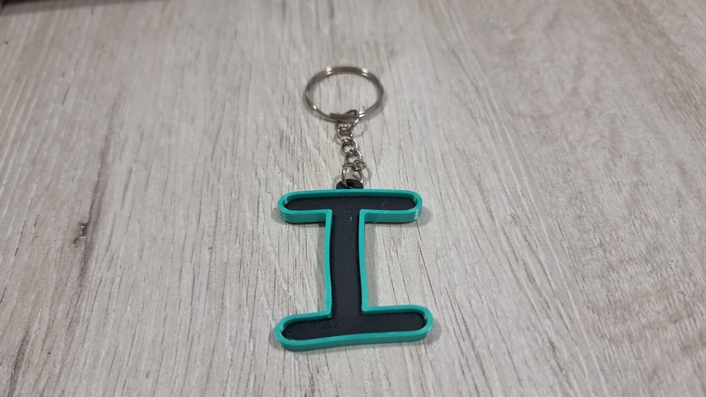 Letters for keychains with raised edge