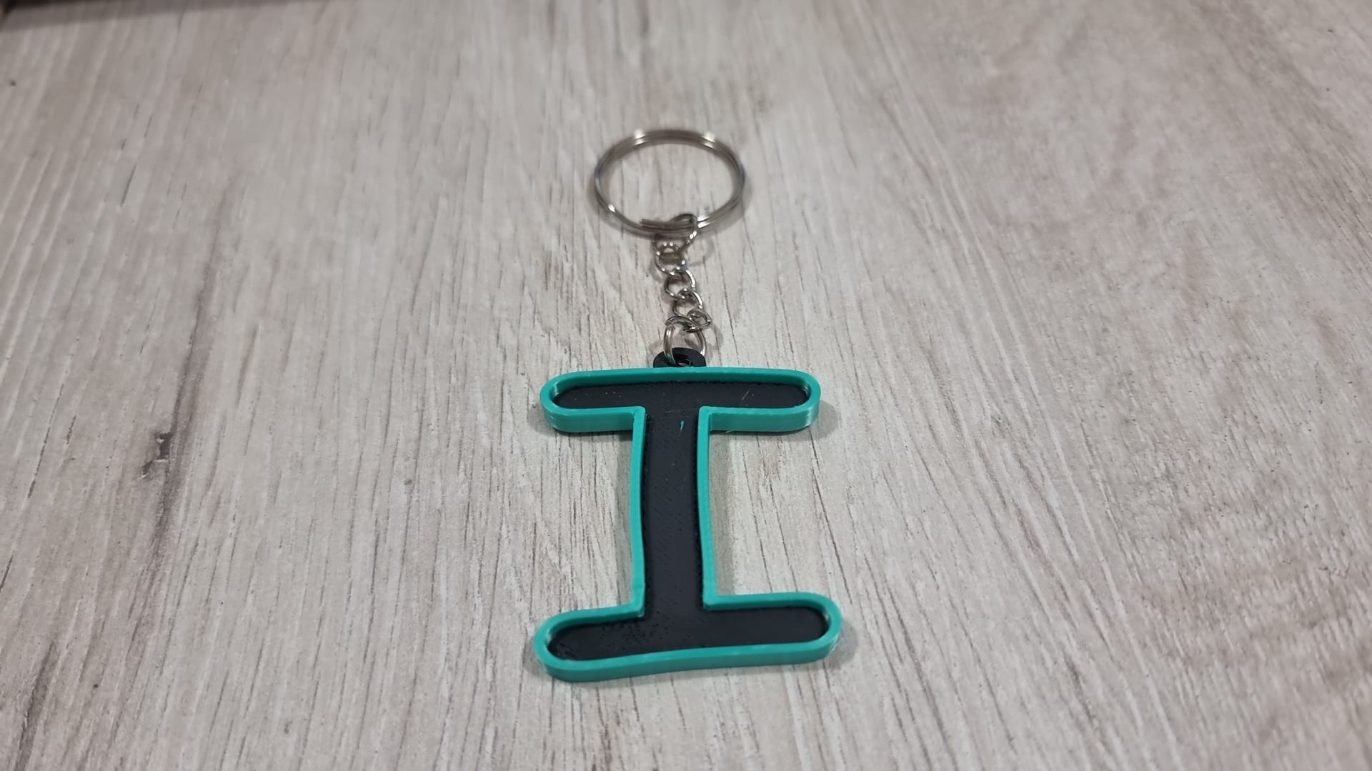 Letters for keychains with raised edge