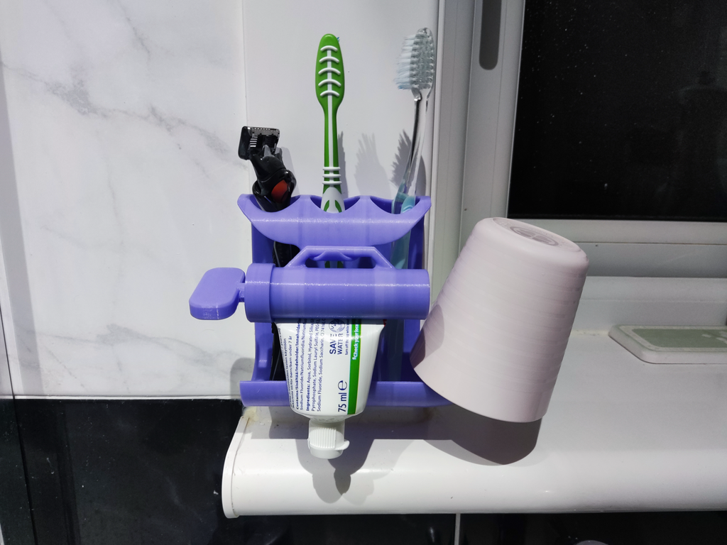 Toothpaste squeezer and toothbrush holder